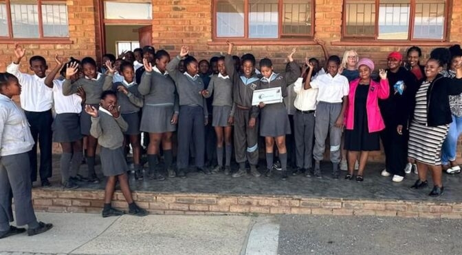 Designer Travel donates laptop to school in memory of Angela Mayall