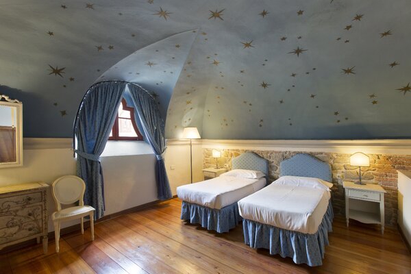 122bTenutaDiArtimino_MeliaCollection-Borgo_one_Bedroom_Lodge_bedroom (1).jpg