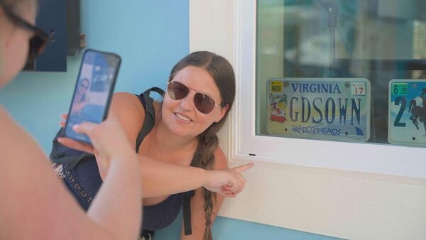 Danielle Dickens from Hays Travel completing a photo task in Sunset Walk