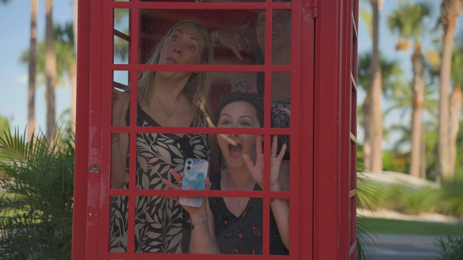 Sarah Hart, Lavinia Chew and Gemma Larder completing a photo challenge in Sunset Walk