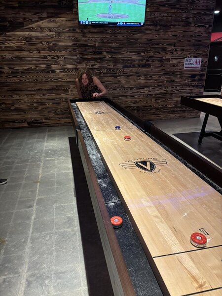 Leanne Rudd from Travel Counsellors trying her hand at Shuffleboard