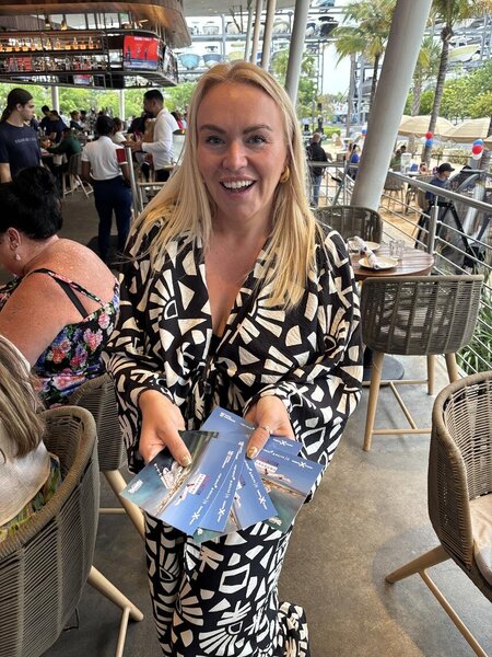 Sarah Graham from Virgin holding Destination Unknown points postcards