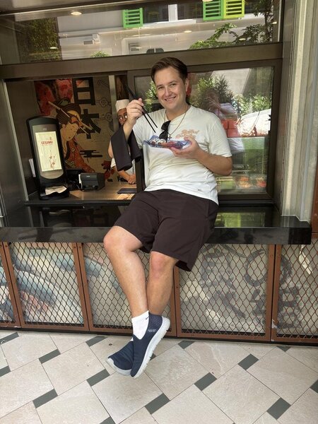 Sam Griffiths completing a photo challenge at Icon of the Seas' Izumi restaurant